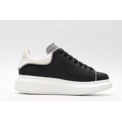 AMQ black oversized sneakers with siL*Ver heel